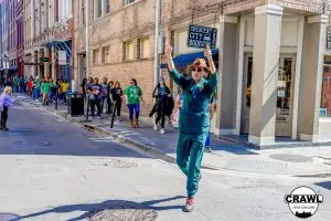 A local guide leading a group on a VIP bar crawl in the French Quarter of New Orleans